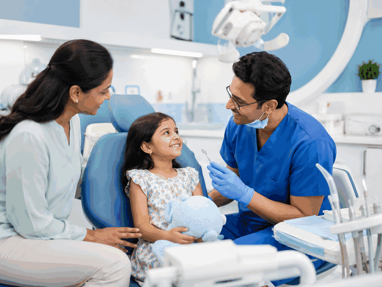 Child receiving preventive dental guidance with a parent